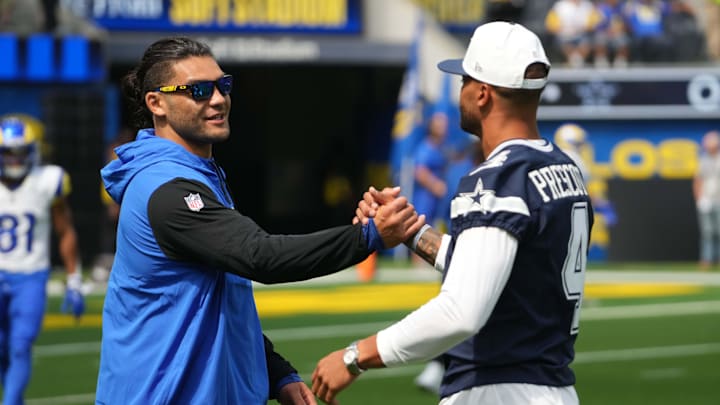 Aug 9, 2025; Inglewood, California, USA; Dallas Cowboys quarterback Dak Prescott (4) shakes hands with wide receiver Puka Nacua during the game at SoFi Stadium. Mandatory Credit: Kirby Lee-Imagn Images