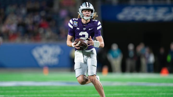 Dec 28, 2023; Orlando, FL, USA; Kansas State quarterback Avery Johnson (2) runs the ball against NC State in the second quarter at Camping World Stadium. Mandatory Credit: Jeremy Reper-USA TODAY Sports