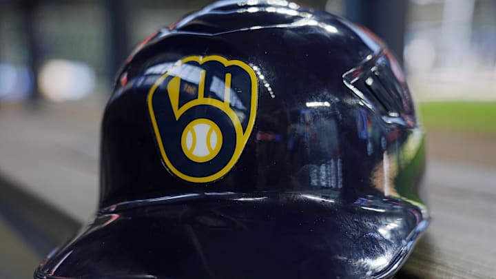 Jun 10, 2024; Milwaukee, Wisconsin, USA;  A Milwaukee Brewers batting helmet sits on the bench during batting practice prior to the game against the Toronto Blue Jays at American Family Field. Mandatory Credit: Jeff Hanisch-Imagn Images