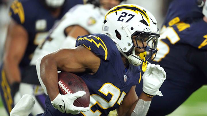 Nov 25, 2024; Inglewood, California, USA; Los Angeles Chargers running back J.K. Dobbins (27) carries the ball against the Baltimore Ravens in the first half at SoFi Stadium. Mandatory Credit: Kirby Lee-Imagn Images