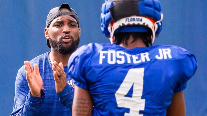 Will Harris, former UW secondary coach, directs his Florida defensive backs. 
