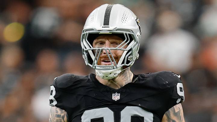 Las Vegas Raiders defensive end Maxx Crosby (98) prepares for a play against the Miami Dolphins at Allegiant Stadium. Las Vegas Raiders defensive end Maxx Crosby (98) prepares for a play against the Miami Dolphins at Allegiant Stadium.