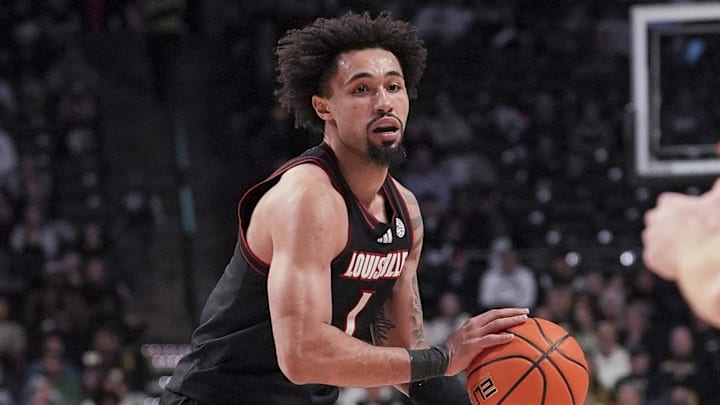 Feb 7, 2026; Winston-Salem, North Carolina, USA; Louisville Cardinals guard J'vonne Hadley (1) handles the ball against the Wake Forest Demon Deacons during the second half at Lawrence Joel Veterans Memorial Coliseum. Mandatory Credit: Jim Dedmon-Imagn Images