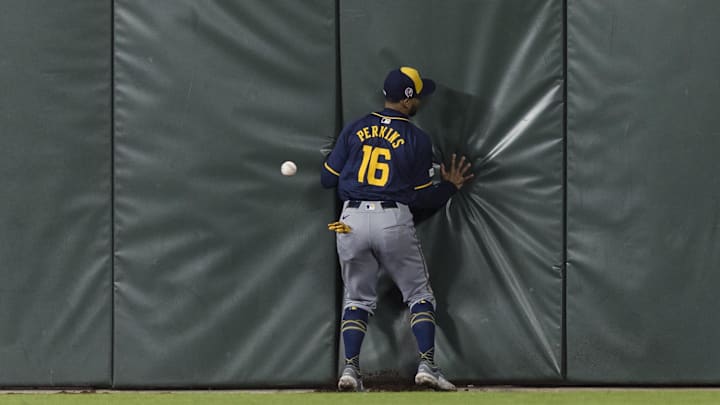 Sep 11, 2024; San Francisco, California, USA; Milwaukee Brewers center fielder Blake Perkins (16) chases a deep fly ball against the San Francisco Giants during the eighth inning at Oracle Park. Mandatory Credit: John Hefti-Imagn Images
