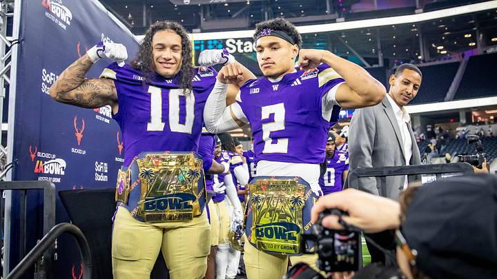 Xe'ree Alexander and Demond Williams Jr. show off their MVP awards at the LA Bowl. 