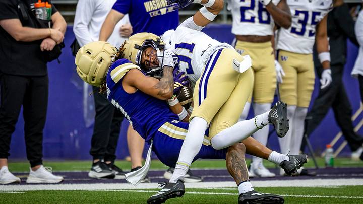 Paul Mencke gets pulled down by Rashid Williams after intercepting a pass meant for Williams in the Spring Game. Paul Mencke gets pulled down by Rashid Williams after intercepting a pass meant for Williams in the Spring Game.