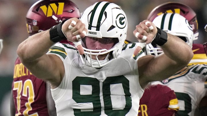 Green Bay Packers defensive end Lukas Van Ness (90) cleats tacking Washington Commanders running back Austin Ekeler for a loss during the first quarter of their game Thursday, September 11, 2025, at Lambeau Field in Green Bay, Wisconsin.