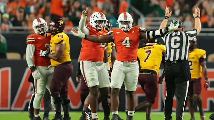 Sep 6, 2025; Miami Gardens, Florida, USA; Miami Hurricanes defensive lineman Rueben Bain Jr. (4) reacts after a sack against the Bethune-Cookman Wildcats during the third quarter at Hard Rock Stadium. Mandatory Credit: Sam Navarro-Imagn Images