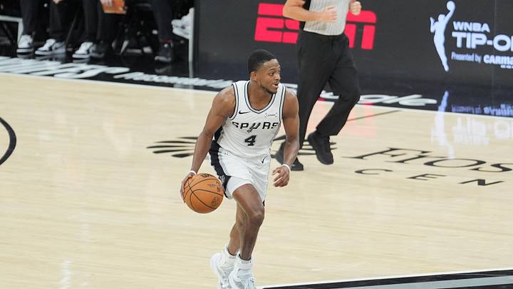 May 6, 2026; San Antonio, Texas, USA; San Antonio Spurs guard De'aaron Fox (4) dribbles up the court in the first half against the Minnesota Timberwolves during game two of the second round of the 2026 NBA Playoffs at Frost Bank Center. Mandatory Credit: Daniel Dunn-Imagn Images
