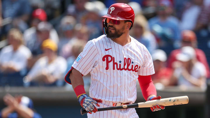 Mar 8, 2025; Clearwater, Florida, USA; Philadelphia Phillies designated hitter Kyle Schwarber (12) reacts after striking out against the Toronto Blue Jays in the first inningduring spring training at BayCare Ballpark.