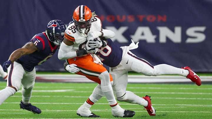 Jan 13, 2024; Houston, Texas, USA; Cleveland Browns tight end David Njoku (85) is tackled by Cleveland Browns safety Tanner McCalister (48) in a 2024 AFC wild card game at NRG Stadium.