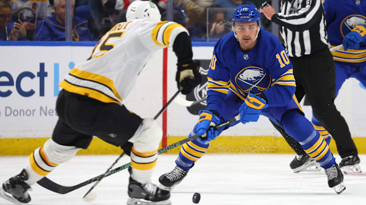 Mar 25, 2026; Buffalo, New York, USA; Boston Bruins defenseman Jonathan Aspirot (45) makes a pass as Buffalo Sabres center Sam Carrick (10) defends during the second period at KeyBank Center. Mandatory Credit: Timothy T. Ludwig-Imagn Images Mar 25, 2026; Buffalo, New York, USA; Boston Bruins defenseman Jonathan Aspirot (45) makes a pass as Buffalo Sabres center Sam Carrick (10) defends during the second period at KeyBank Center. Mandatory Credit: Timothy T. Ludwig-Imagn Images