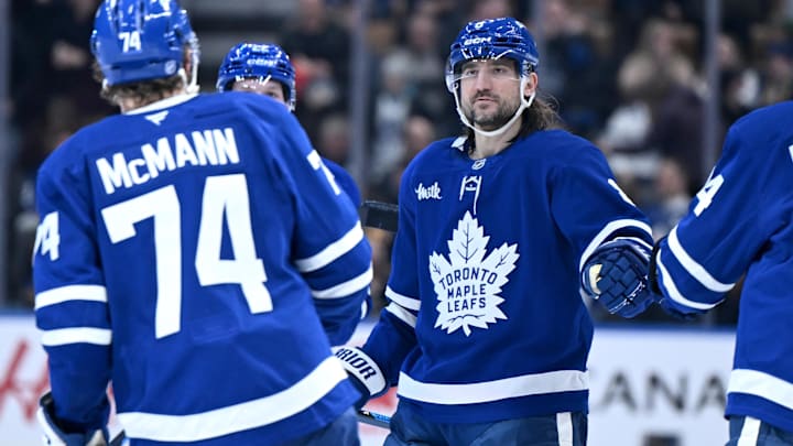 Dec 23, 2025; Toronto, Ontario, CAN;  Toronto Maple Leafs defenseman Chris Tanev (8) greets forward Bobby McMann who scored an empty net goal against the Pittsburgh Penguins in the third period at Scotiabank Arena. Mandatory Credit: Dan Hamilton-Imagn Images