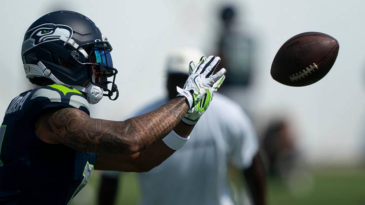 Seahawks wide receiver Jaxon Smith-Njigba makes a catch in warmups during joint practice with the Titans.