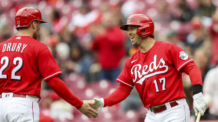 Cincinnati Reds shortstop Kyle Farmer (17) reacts with second baseman Brandon Drury.
