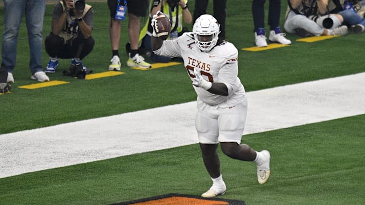 Dec 2, 2023; Arlington, TX, USA; Texas Longhorns defensive lineman T'Vondre Sweat (93) celebrates