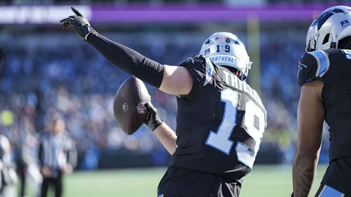 Dec 22, 2024; Charlotte, North Carolina, USA; Carolina Panthers wide receiver Adam Thielen (19) reacts to his touchdown catch against the Arizona Cardinals during the second quarter at Bank of America Stadium.