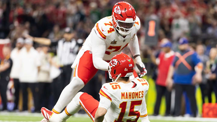 Feb 9, 2025; New Orleans, LA, USA; Kansas City Chiefs offensive tackle Jawaan Taylor (74) helps up quarterback Patrick Mahomes (15) against the Philadelphia Eagles in Super Bowl LIX at Ceasars Superdome. Mandatory Credit: Mark J. Rebilas-Imagn Images Feb 9, 2025; New Orleans, LA, USA; Kansas City Chiefs offensive tackle Jawaan Taylor (74) helps up quarterback Patrick Mahomes (15) against the Philadelphia Eagles in Super Bowl LIX at Ceasars Superdome. Mandatory Credit: Mark J. Rebilas-Imagn Images