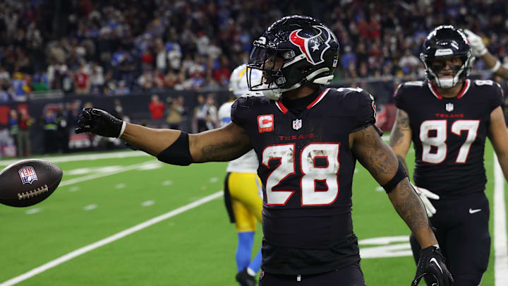 Houston Texans running back Joe Mixon (28) reacts to his rushing first down against the Los Angeles Chargers in the fourth quarter in an AFC wild card game at NRG Stadium. Houston Texans running back Joe Mixon (28) reacts to his rushing first down against the Los Angeles Chargers in the fourth quarter in an AFC wild card game at NRG Stadium.