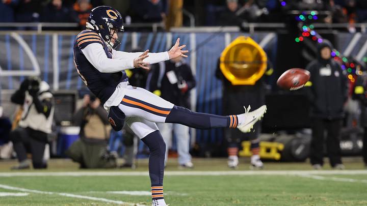 Dec 20, 2025; Chicago, Illinois, USA; Chicago Bears punter Tory Taylor (19) punts the ball against the Green Bay Packers during the third quarter at Soldier Field. Mandatory Credit: Mike Dinovo-Imagn Images