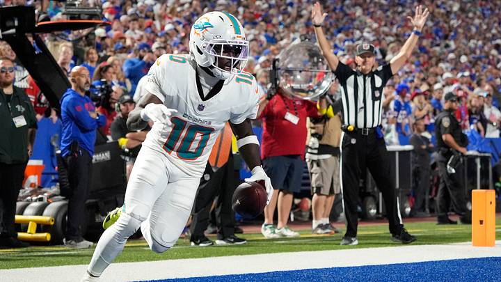 Sep 18, 2025; Orchard Park, New York, USA; Miami Dolphins wide receiver Tyreek Hill (10) scores a touchdown against the Buffalo Bills in the fourth quarter at Highmark Stadium. Mandatory Credit: Gregory Fisher-Imagn Images Sep 18, 2025; Orchard Park, New York, USA; Miami Dolphins wide receiver Tyreek Hill (10) scores a touchdown against the Buffalo Bills in the fourth quarter at Highmark Stadium. Mandatory Credit: Gregory Fisher-Imagn Images