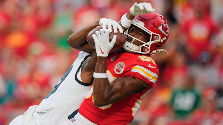 Sep 14, 2025; Kansas City, Missouri, USA; Kansas City Chiefs wide receiver Tyquan Thornton (80) makes a reception for a touchdown defended by Philadelphia Eagles cornerback Quinyon Mitchell (27) during the fourth quarter of the game at GEHA Field at Arrowhead Stadium. Mandatory Credit: Jay Biggerstaff-Imagn Images