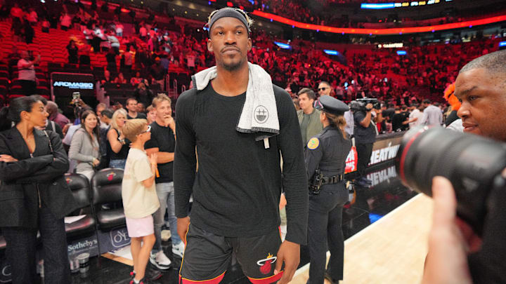 Jan 19, 2025; Miami, Florida, USA;  Miami Heat forward Jimmy Butler (22) walks off the court after greeting court-side friends following the victory over the San Antonio Spurs at Kaseya Center. Mandatory Credit: Jim Rassol-Imagn Images
