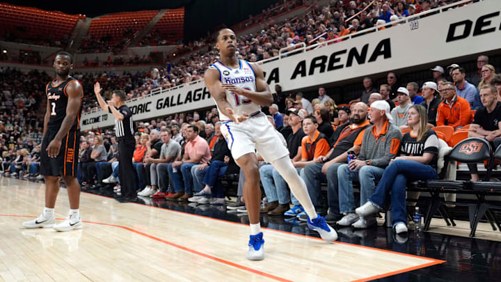 Kansas Jayhawks guard Elmarko Jackson (13) celebrates beside Oklahoma State Cowboys guard Kanye Clary (1) after making a 3-pointer during a men's college basketball game between the Oklahoma State Cowboys and the Kansas Jayhawks at Gallagher-Iba Arena in Stillwater, Okla., Wednesday, Feb. 18, 2026. Kansas Jayhawks guard Elmarko Jackson (13) celebrates beside Oklahoma State Cowboys guard Kanye Clary (1) after making a 3-pointer during a men's college basketball game between the Oklahoma State Cowboys and the Kansas Jayhawks at Gallagher-Iba Arena in Stillwater, Okla., Wednesday, Feb. 18, 2026.