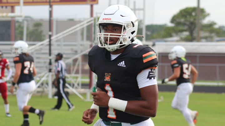 Tramell Jones trots off the field during a jamboree with Mandarin, St. Augustine and Bishop Kenny on Wednesday.