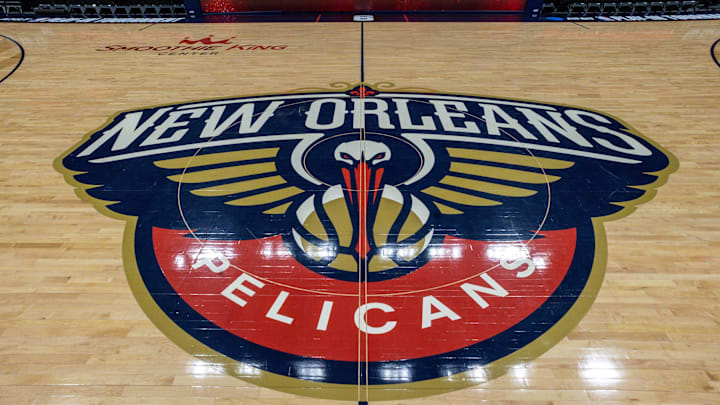 Apr 12, 2023; New Orleans, Louisiana, USA; Detailed view of the New Orleans Pelicans logo at mid court before the Play-In game against the Oklahoma City Thunder at Smoothie King Center. Apr 12, 2023; New Orleans, Louisiana, USA; Detailed view of the New Orleans Pelicans logo at mid court before the Play-In game against the Oklahoma City Thunder at Smoothie King Center.