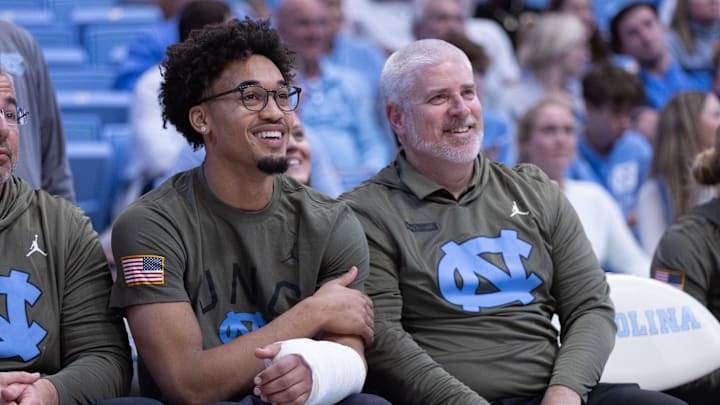 Nov 11, 2025; Chapel Hill, North Carolina, USA; North Carolina Tar Heels guard Seth Trimble (7) watches from the bench in the second half against the Radford Highlanders at Dean E. Smith Center. Mandatory Credit: Scott Kinser-Imagn Images Nov 11, 2025; Chapel Hill, North Carolina, USA; North Carolina Tar Heels guard Seth Trimble (7) watches from the bench in the second half against the Radford Highlanders at Dean E. Smith Center. Mandatory Credit: Scott Kinser-Imagn Images