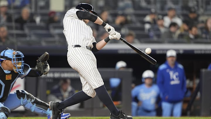 Apr 14, 2025; Bronx, New York, USA; New York Yankees designated hitter Ben Rice (22) hits a home run against the Kansas City Royals during the fifth inning at Yankee Stadium. 