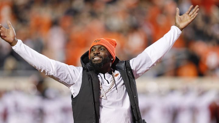 Nov 27, 2021; Stillwater, Oklahoma, USA; Oklahoma State Cowboys former receiver Dez Bryant waves to the fans during the first half of a game against the Oklahoma Sooners at Boone Pickens Stadium. Mandatory Credit: Alonzo Adams-Imagn Images