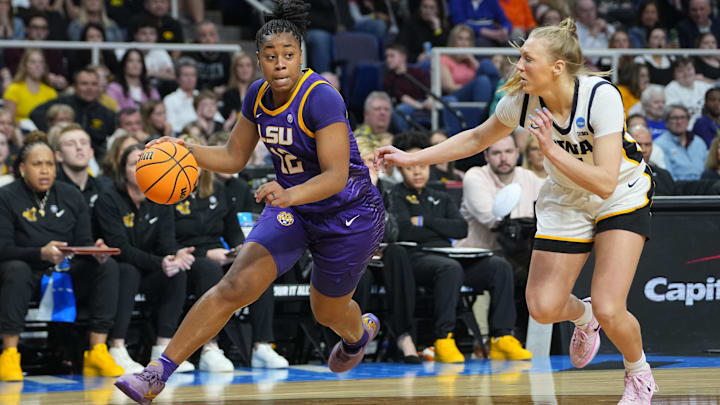 Apr 1, 2024; Albany, NY, USA; LSU Lady Tigers guard Mikaylah Williams (12) controls the ball against Iowa Hawkeyes guard Sydney Affolter (3) in the second quarter in the finals of the Albany Regional in the 2024 NCAA Tournament at MVP Arena. Mandatory Credit: Gregory Fisher-Imagn Images Apr 1, 2024; Albany, NY, USA; LSU Lady Tigers guard Mikaylah Williams (12) controls the ball against Iowa Hawkeyes guard Sydney Affolter (3) in the second quarter in the finals of the Albany Regional in the 2024 NCAA Tournament at MVP Arena. Mandatory Credit: Gregory Fisher-Imagn Images