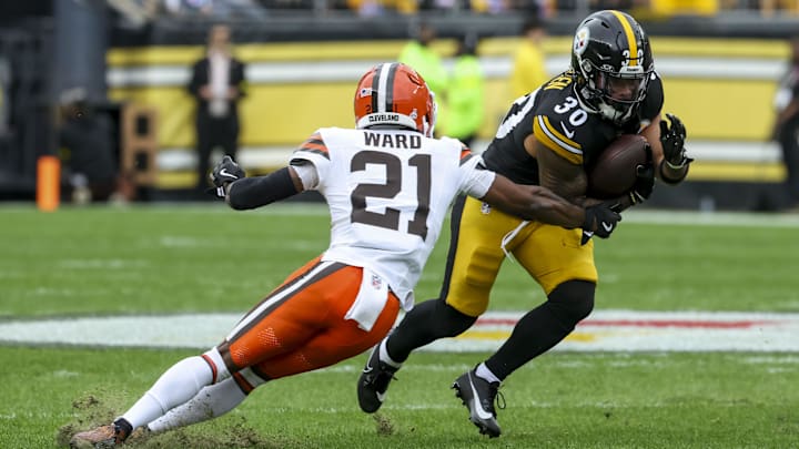 Oct 12, 2025; Pittsburgh, Pennsylvania, USA; Pittsburgh Steelers running back Jaylen Warren (30) runs the ball while Cleveland Browns cornerback Denzel Ward (21) defends during the first quarter at Acrisure Stadium. Mandatory Credit: Charles LeClaire-Imagn Images Oct 12, 2025; Pittsburgh, Pennsylvania, USA; Pittsburgh Steelers running back Jaylen Warren (30) runs the ball while Cleveland Browns cornerback Denzel Ward (21) defends during the first quarter at Acrisure Stadium. Mandatory Credit: Charles LeClaire-Imagn Images