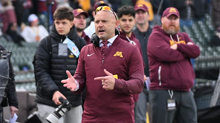Nov 22, 2025; Chicago, Illinois, USA; Minnesota Golden Gophers head coach P.J. Fleck directs his team against the Northwestern Wildcats during the first half at Wrigley Field. Mandatory Credit: Patrick Gorski-Imagn Images