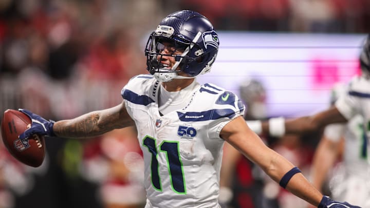 Seattle Seahawks wide receiver Jaxon Smith-Njigba (11) celebrates after a touchdown catch against the Atlanta Falcons in the fourth quarter at Mercedes-Benz Stadium. 