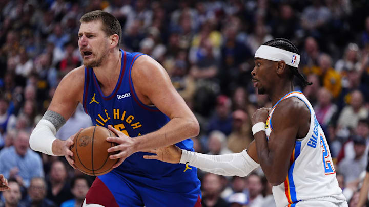 May 9, 2025; Denver, Colorado, USA; Oklahoma City Thunder guard Shai Gilgeous-Alexander (2) defends on Denver Nuggets center Nikola Jokic (15) in the second half during game three of the second round for the 2025 NBA Playoffs at Ball Arena.