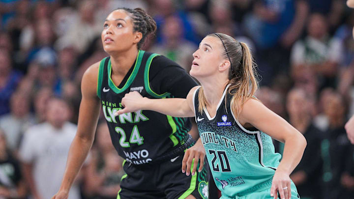 Jul 30, 2025; Minneapolis, Minnesota, USA; New York Liberty guard Sabrina Ionescu (20) and Minnesota Lynx forward Napheesa Collier (24) in the first quarter at Target Center. Mandatory Credit: Brad Rempel-Imagn Images