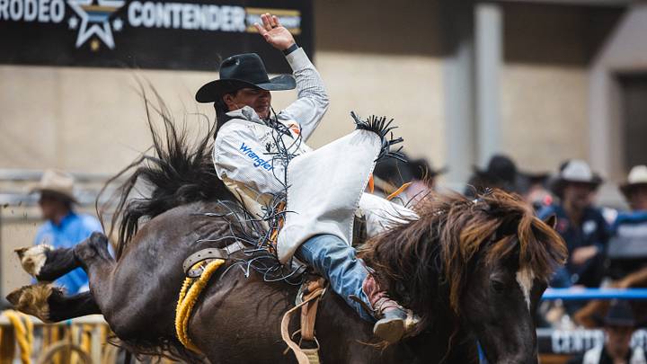 Clayton Biglow aboard Rafter H Rodeo Livestock's Cat Ballou in Tulsa, Okla. at the American Rodeo Contender Central Regionals Clayton Biglow aboard Rafter H Rodeo Livestock's Cat Ballou in Tulsa, Okla. at the American Rodeo Contender Central Regionals