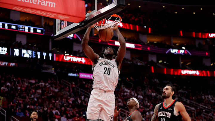 Feb 1, 2025; Houston, Texas, USA; Brooklyn Nets center Day'Ron Sharpe (20) dunks against the Houston Rockets during the third quarter at Toyota Center. Mandatory Credit: Erik Williams-Imagn Images
