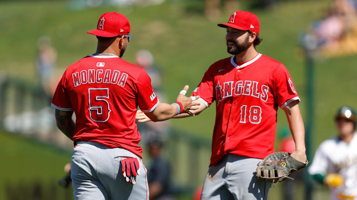 May 22, 2025; West Sacramento, California, USA; Los Angeles Angels third baseman Yoán Moncada (5) and first baseman Nolan Schanuel (18) shake hands after the game against the Athletics at Sutter Health Park. Mandatory Credit: Sergio Estrada-Imagn Images