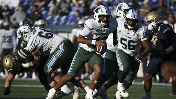 Nov 16, 2024; Annapolis, Maryland, USA; Tulane Green Wave quarterback Darian Mensah (10) rushes during the second half  against the Navy Midshipmen at Navy-Marine Corps Memorial Stadium.