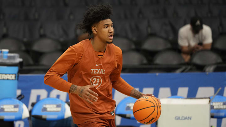 Mar 20, 2024; Charlotte, NC, USA; Texas Longhorns forward Dillon Mitchell (23) during practice at Spectrum Center. Mandatory Credit: Bob Donnan-Imagn Images Mar 20, 2024; Charlotte, NC, USA; Texas Longhorns forward Dillon Mitchell (23) during practice at Spectrum Center. Mandatory Credit: Bob Donnan-Imagn Images