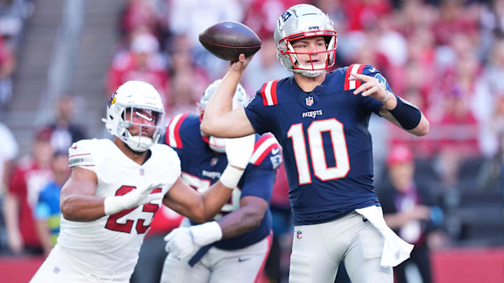 Dec 15, 2024; Glendale, Arizona, USA; New England Patriots quarterback Drake Maye (10) throws against the Arizona Cardinals during the first half at State Farm Stadium. Mandatory Credit: Joe Camporeale-Imagn Images