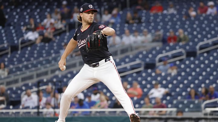 Aug 19, 2025; Washington, District of Columbia, USA; Washington Nationals starting pitcher Jake Irvin (27) throws the ball against the New York Mets during the first inning at Nationals Park. 