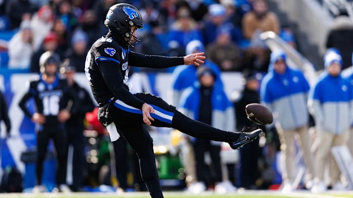 Nov 30, 2024; Lexington, Kentucky, USA; Kentucky Wildcats punter Aidan Laros (48) punts the ball during the first quarter against the Louisville Cardinals at Kroger Field. Mandatory Credit: Jordan Prather-Imagn Images