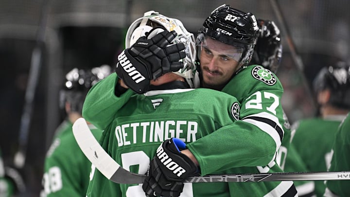 Oct 15, 2024; Dallas, Texas, USA; Dallas Stars goaltender Jake Oettinger (29) and left wing Mason Marchment (27) celebrate the Stars victory over the San Jose Sharks at the American Airlines Center. Mandatory Credit: Jerome Miron-Imagn ImagesOct 15, 2024; Dallas, Texas, USA; during the overtime shootout period at the American Airlines Center. Mandatory Credit: Jerome Miron-Imagn Images