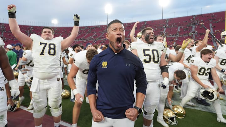 Notre Dame Fighting Irish head coach Marcus Freeman celebrates with players at the end of the game against the Southern California Trojans at United Airlines Field at Los Angeles Memorial Coliseum. Notre Dame Fighting Irish head coach Marcus Freeman celebrates with players at the end of the game against the Southern California Trojans at United Airlines Field at Los Angeles Memorial Coliseum.