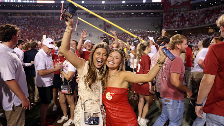 Arkansas Razorbacks fans celebrate in front of the downed goal posts after the game against the Tennessee Volunteers at Donald W. Reynolds Razorback Stadium. Arkansas won 19-14.